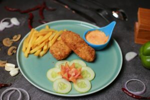Golden fried fish, shrimp, oysters, and calamari arranged on a plate to show different crisp coatings.